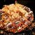 Okonomiyaki topped with flakes